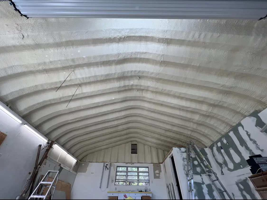 Spray polyurethane foam applied to the underside of a metal roof deck in Fort Scott